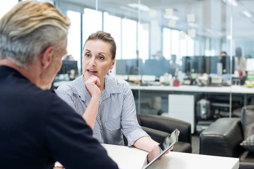Female consultant discussing results shown on a tablet with a client