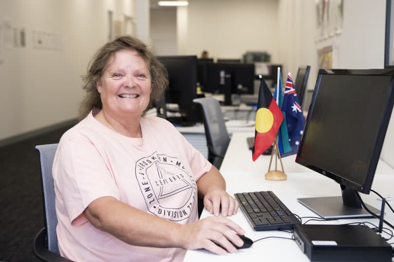 Julie_smiling_at_desk