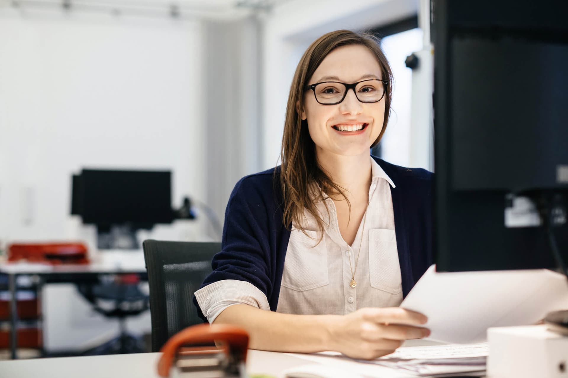 Female office worker sitting at her desk