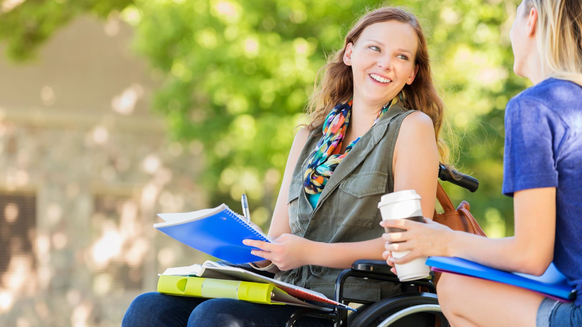 smiling student in wheelchair