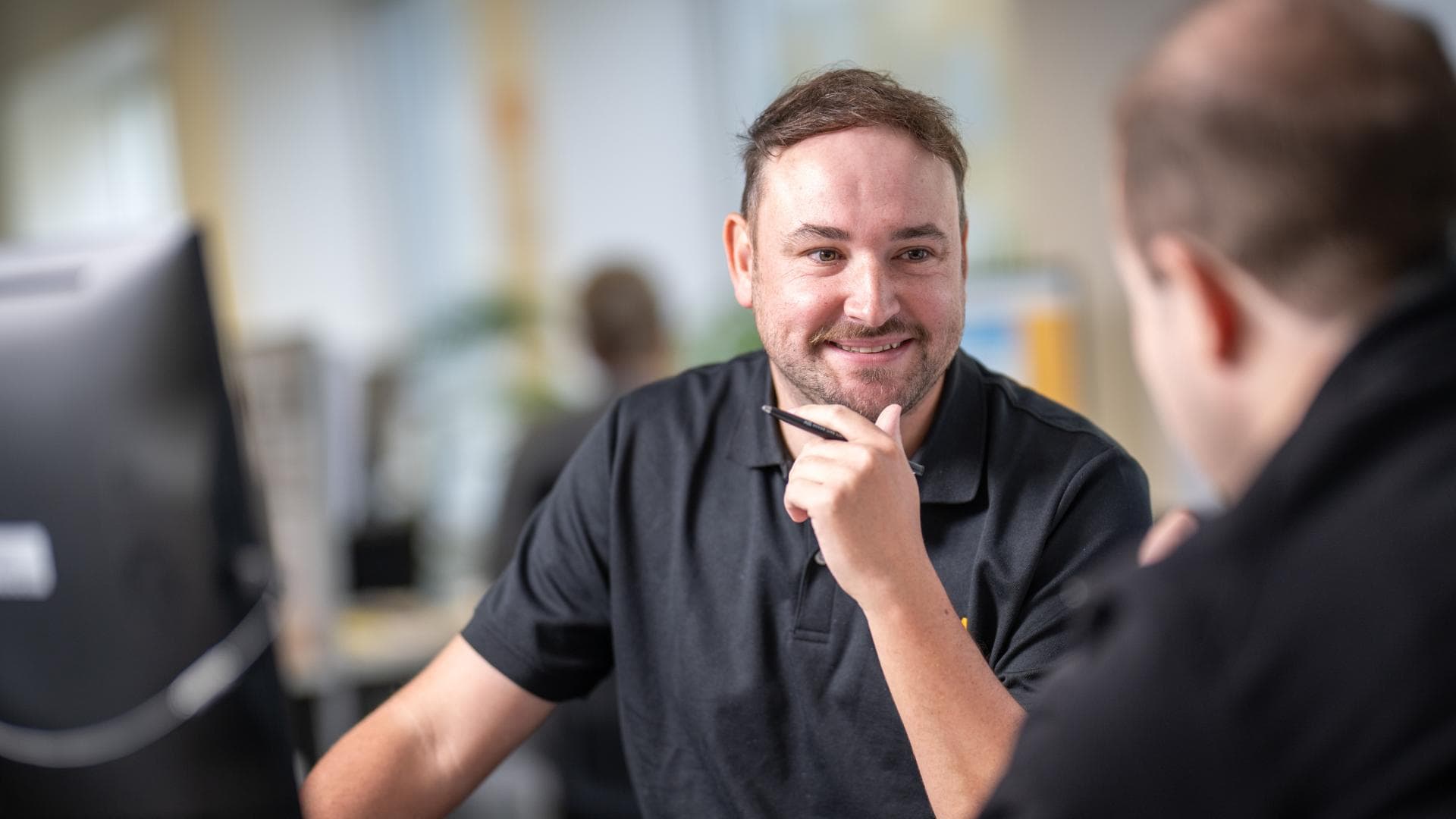 APM team member smiles at participant