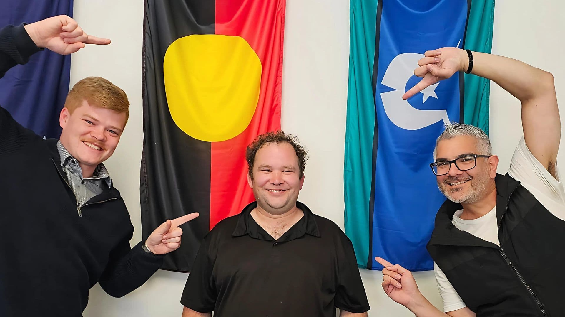 Christian smiles with team members from Glenorchy APM branch