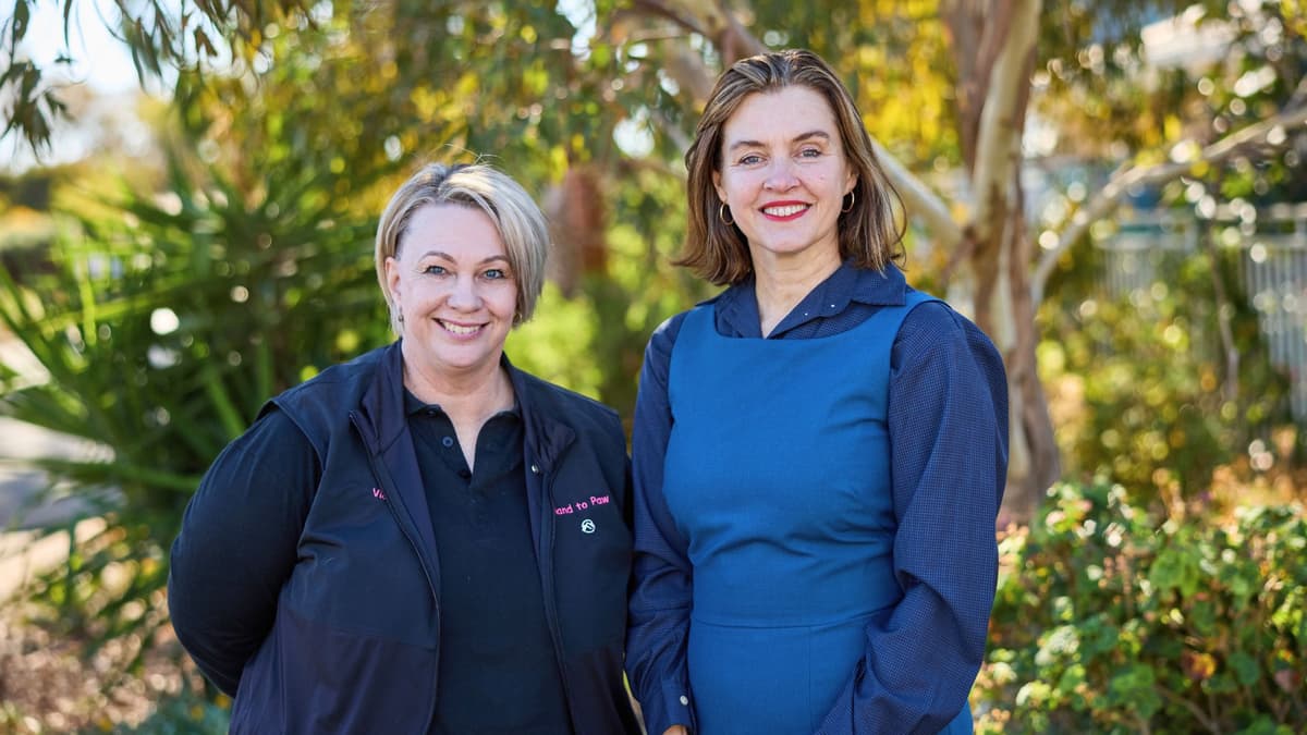 Vicki from Hand to Paw and Rebecca from APM stand outside together