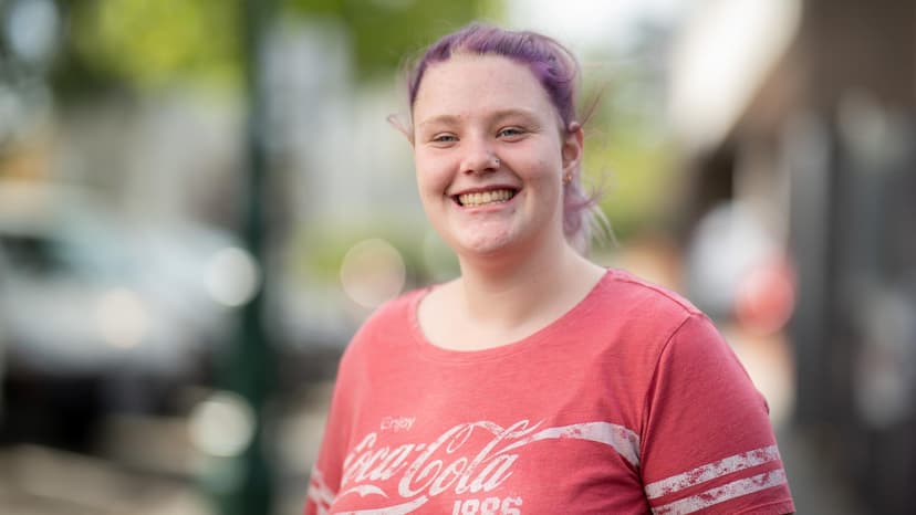 A Workforce Australia participant smiles in conversation with an APM team member