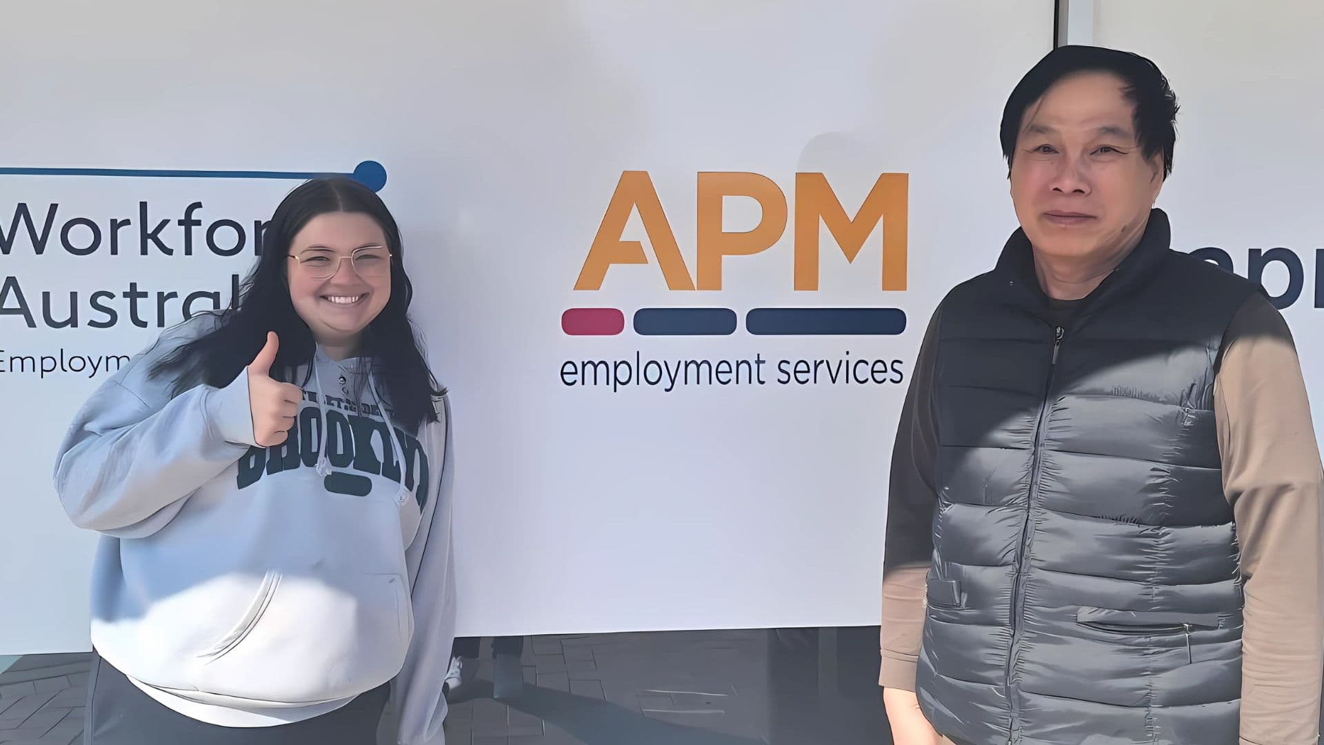 Hanesavath and his employment consultant Lily outside an APM branch