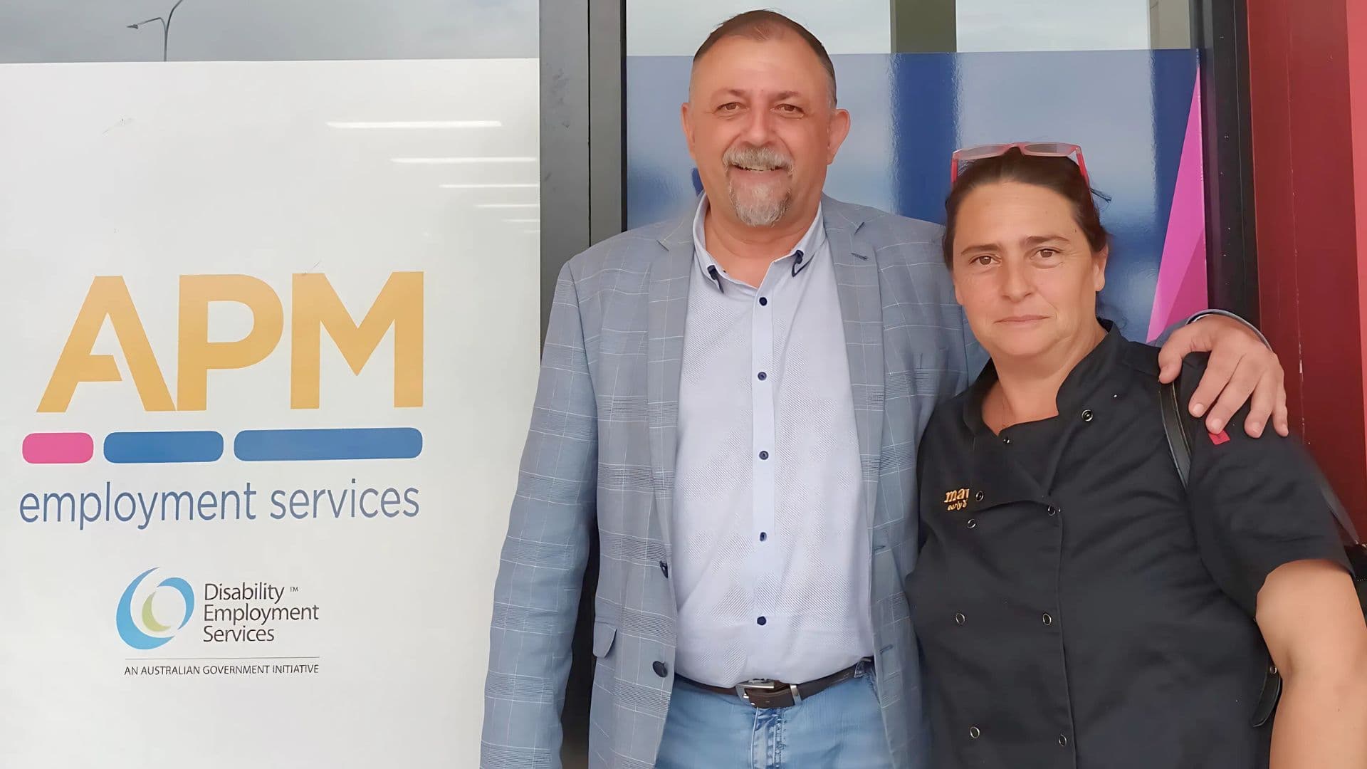 Lucia and Michael outside an APM branch