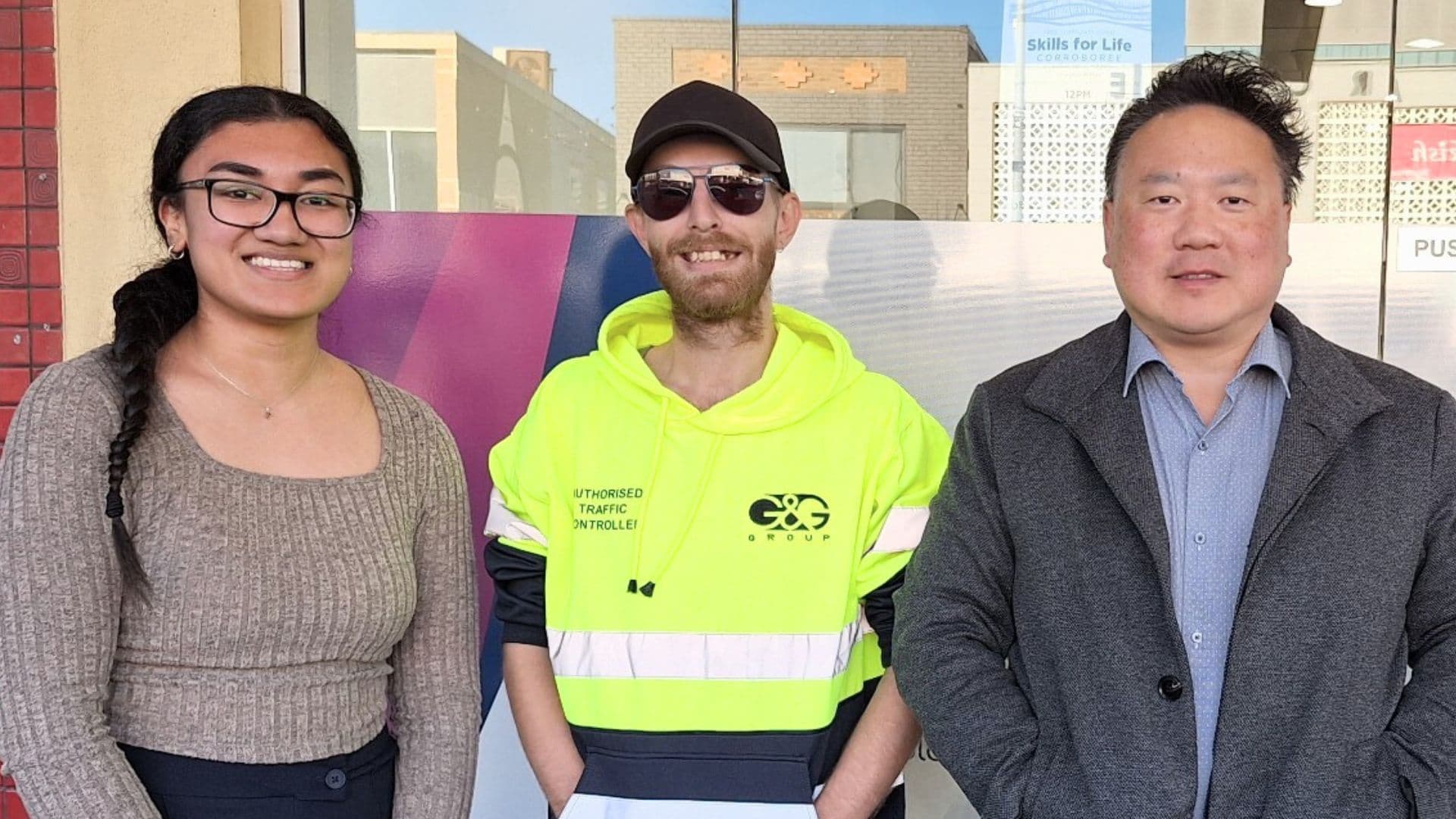 Philip a participant in Workforce Australia stands outside APM between his consultant and development manager