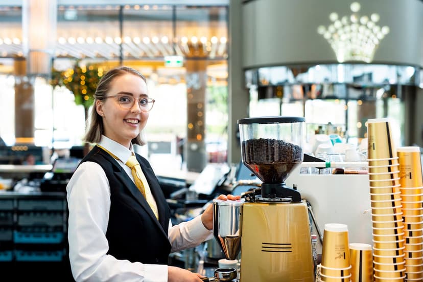 Maegan using a coffee machine