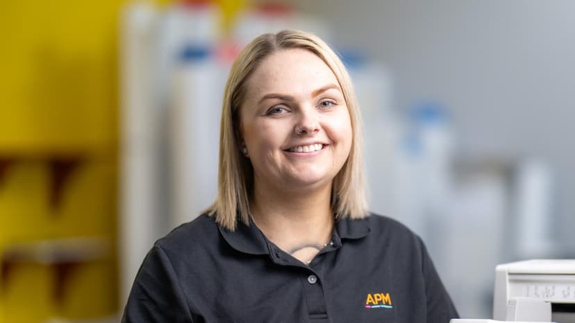 APM employment consultant in a black APM polo