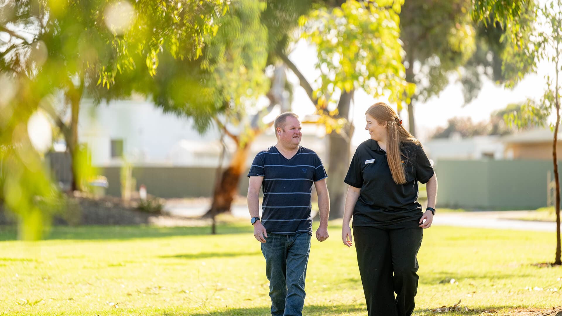 APM client Erice walking with Ellen from APM Employment Services