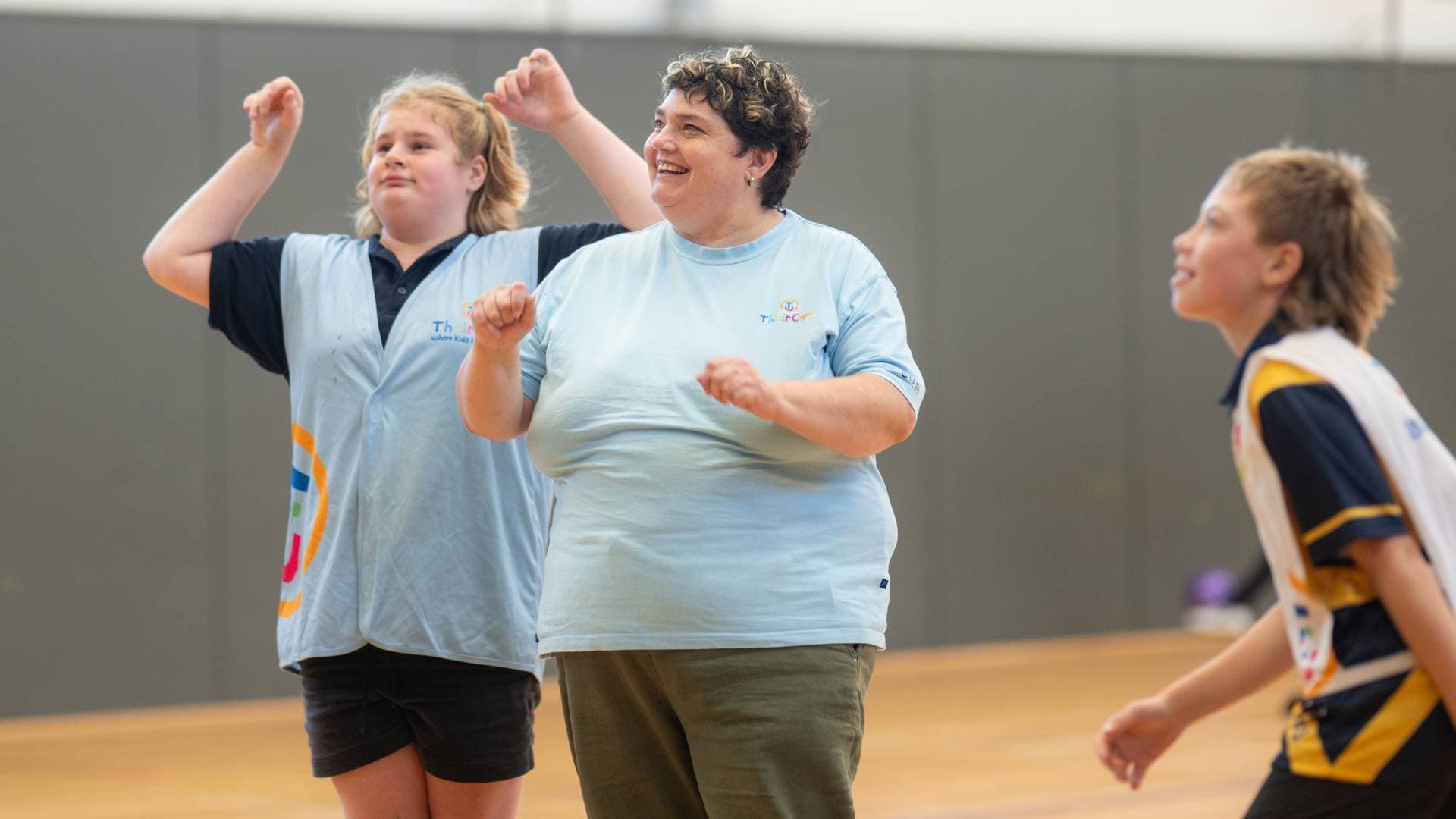 Natalie coaches kids on a sports hall
