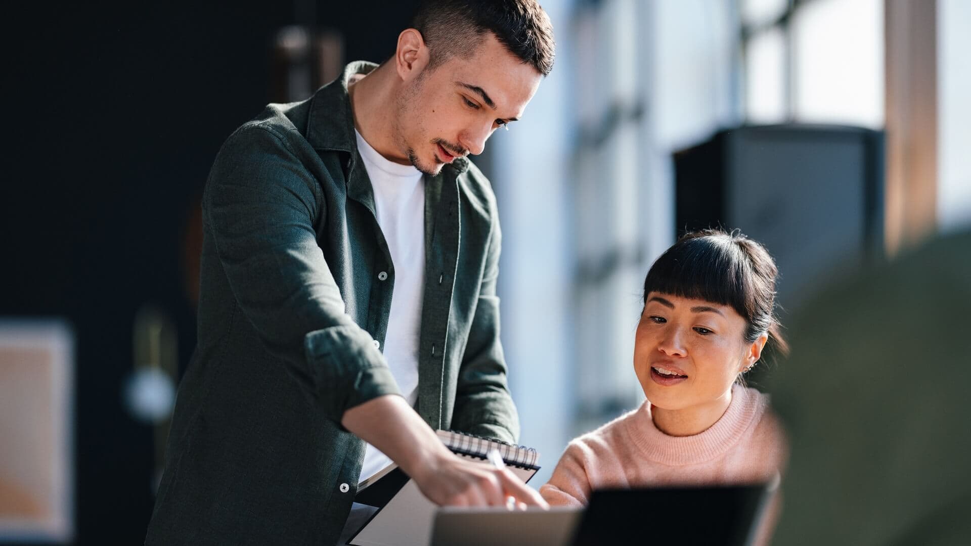 Two colleagues having a discussion about work