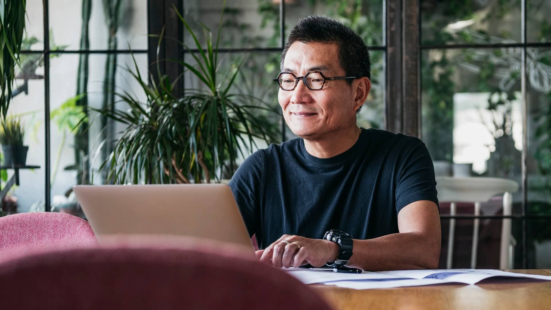 A man working on his laptop at home