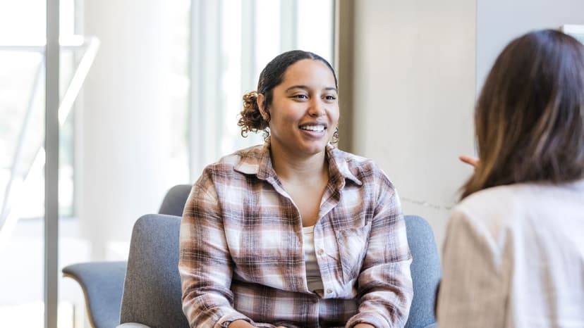 Woman on couch speaking to psychologist