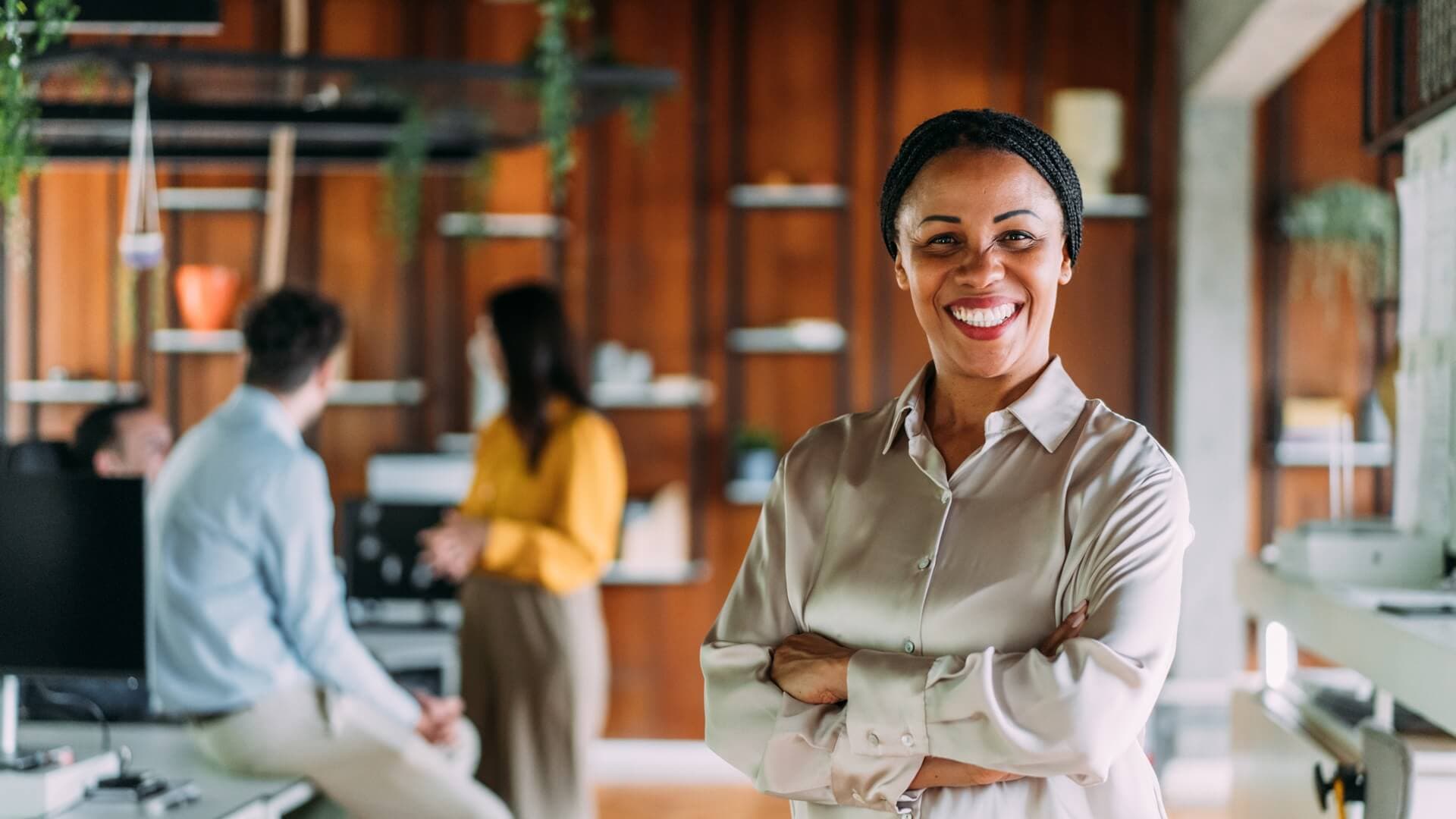 A woman smiling in her workplace