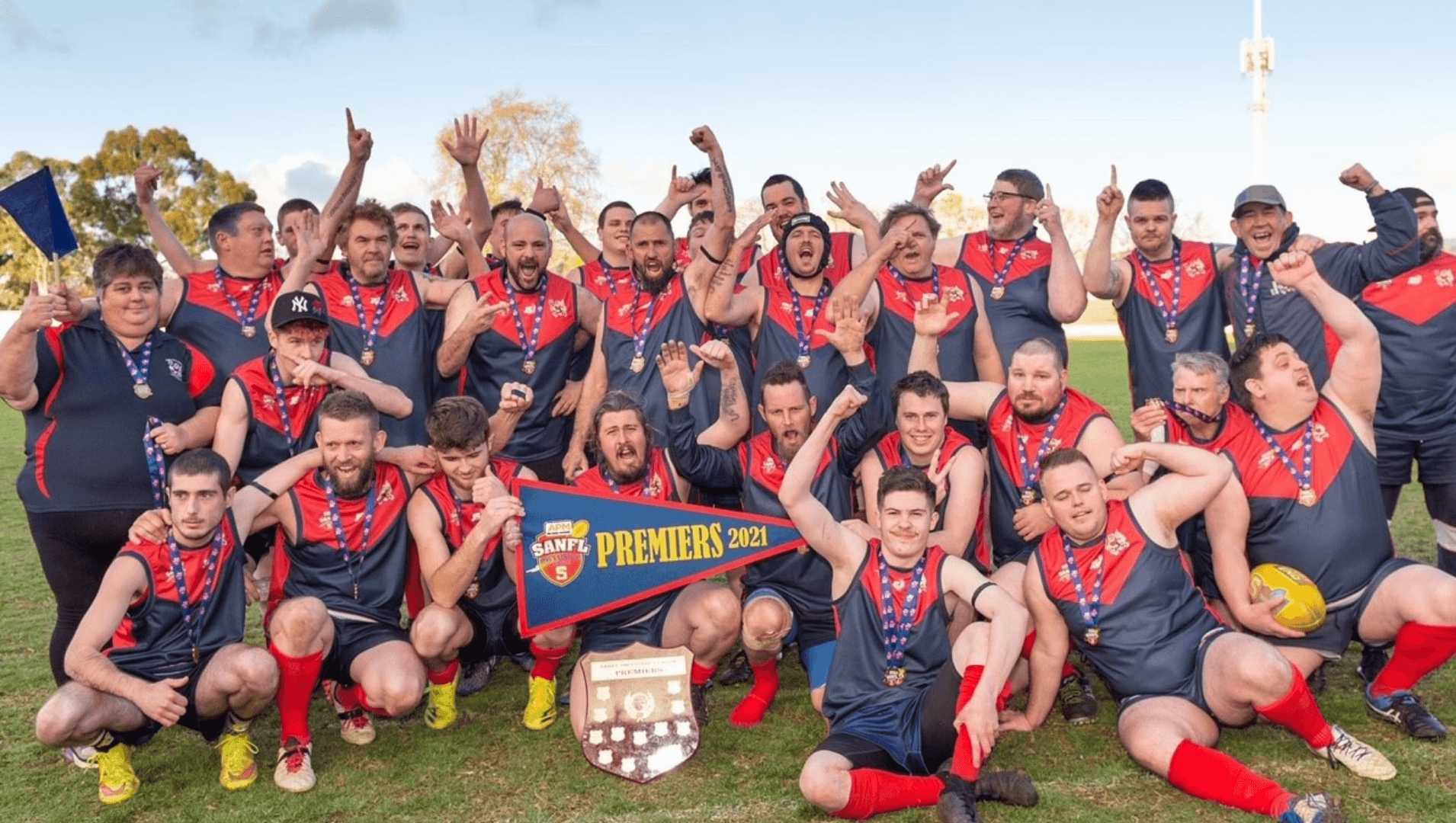 SANFL Inclusive team winners celebrate in a team photo