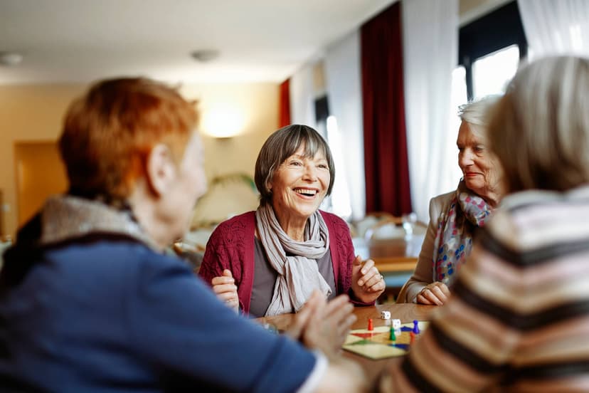 woman smiling with friends at a table
