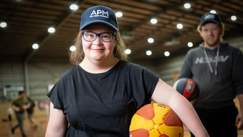 Young girl with APM cap and basketball