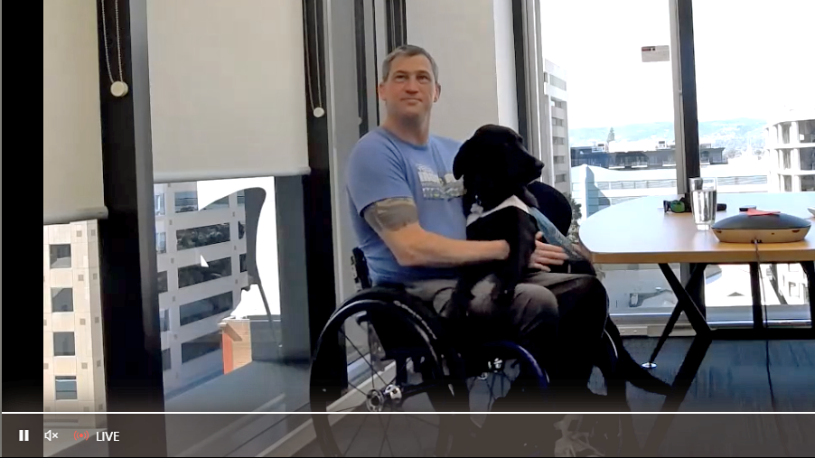 Matt and his helper dog Willow on virtual call with APM Workcare General Manager